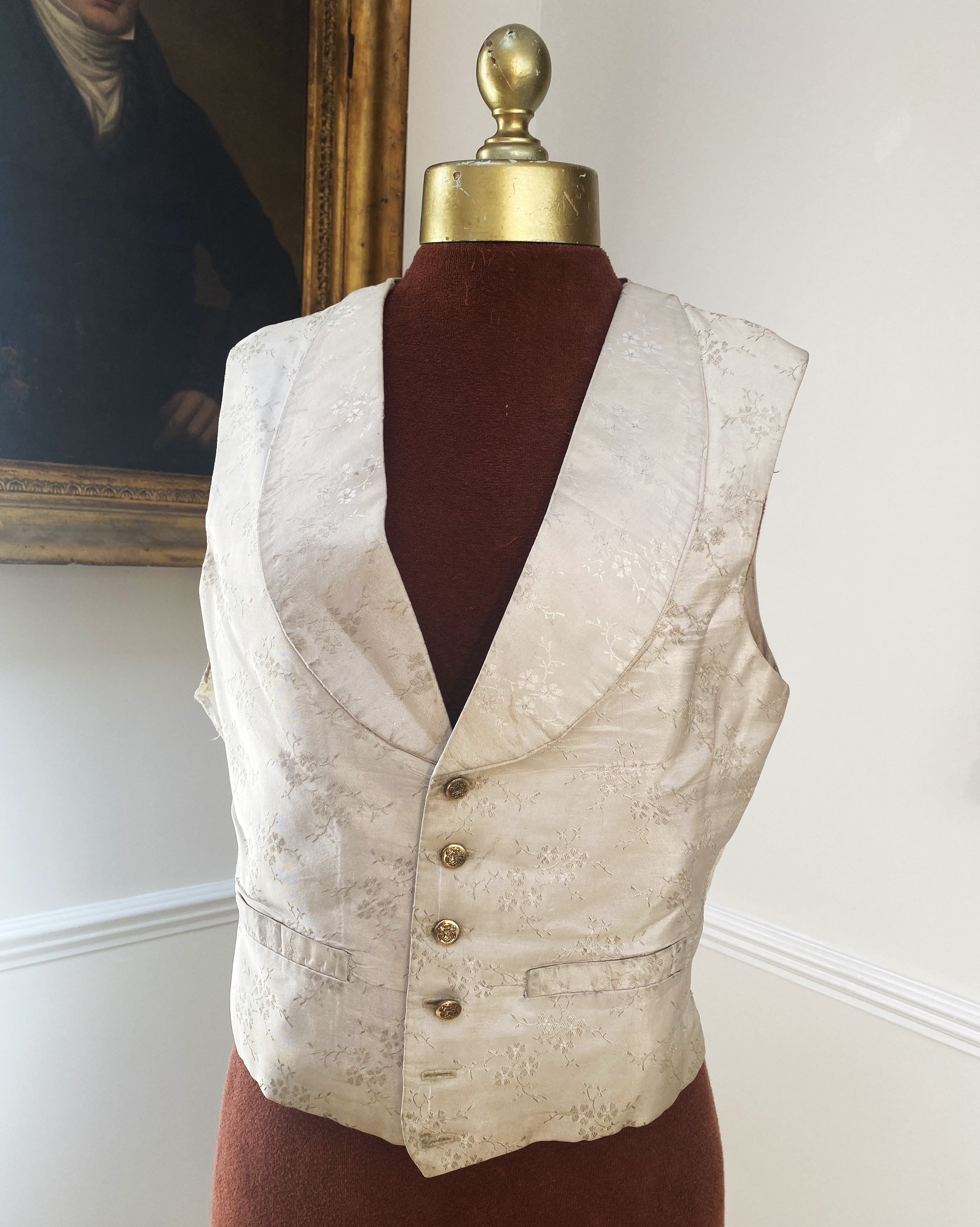 Four silk and brocade waistcoats (one red and three white/cream)